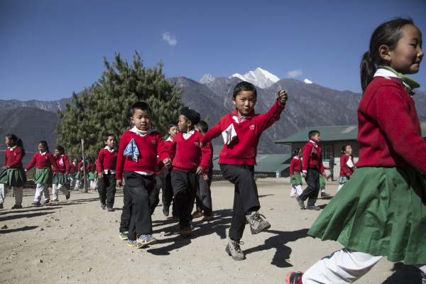 Children take part in 'brain gym' exercises before heading to their classes at the Lukla Primary School, in Lukla, Nepal, on February 20th, 2016.